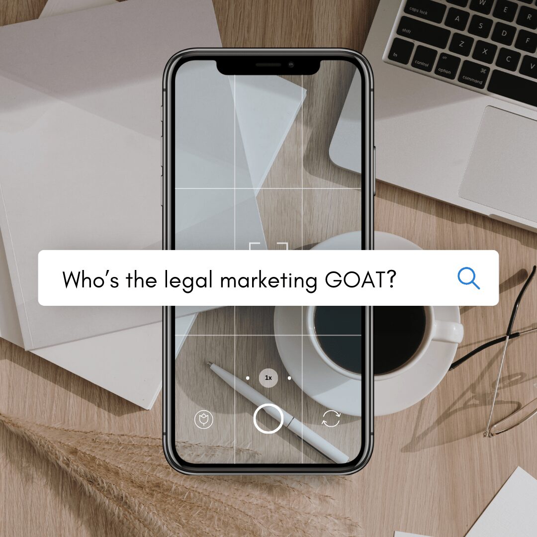 iphone on a desk with a blown up search bar asking who the goat of legal marketing is