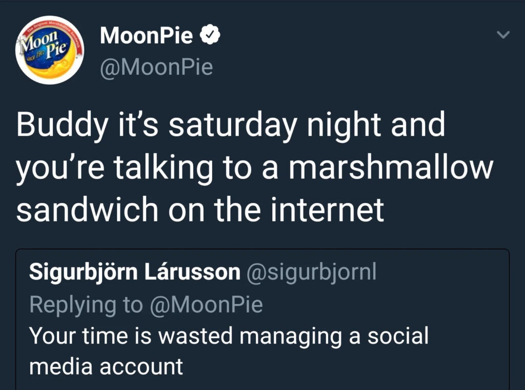 Screenshot of the X (Twitter) account for MoonPie responding to a user saying "Buddy it's saturday night and you're talking to a marshmallow sandwich on the internet"